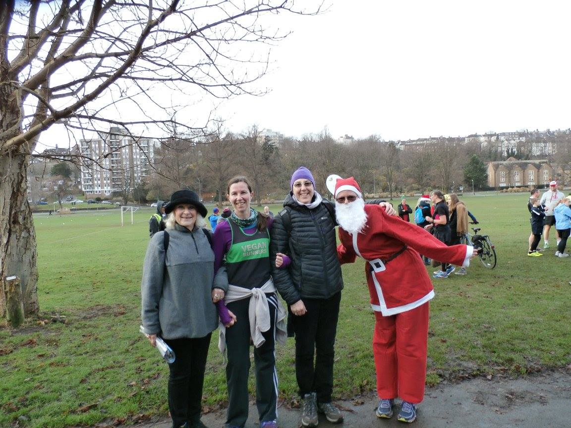 Preston parkrun on Christmas Eve, Julia sports her Vegan Runners club vest while I go all out in a Santa suit. Support by Gerogina and Sue.